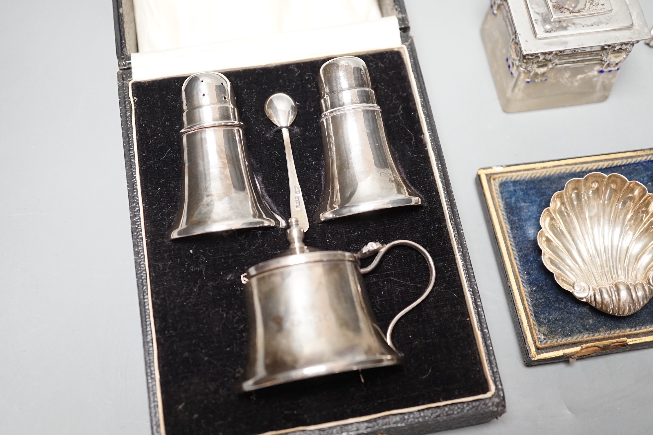 An Austro-Hungarian and enamel mounted glass pot and cover, a cased pair of silver shell salts, a propelling pencil and a cased silver three piece cruet set.